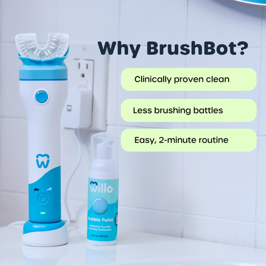 Blue and white dental cleaning device with a bottle labeled 'Willo' on a bathroom counter.