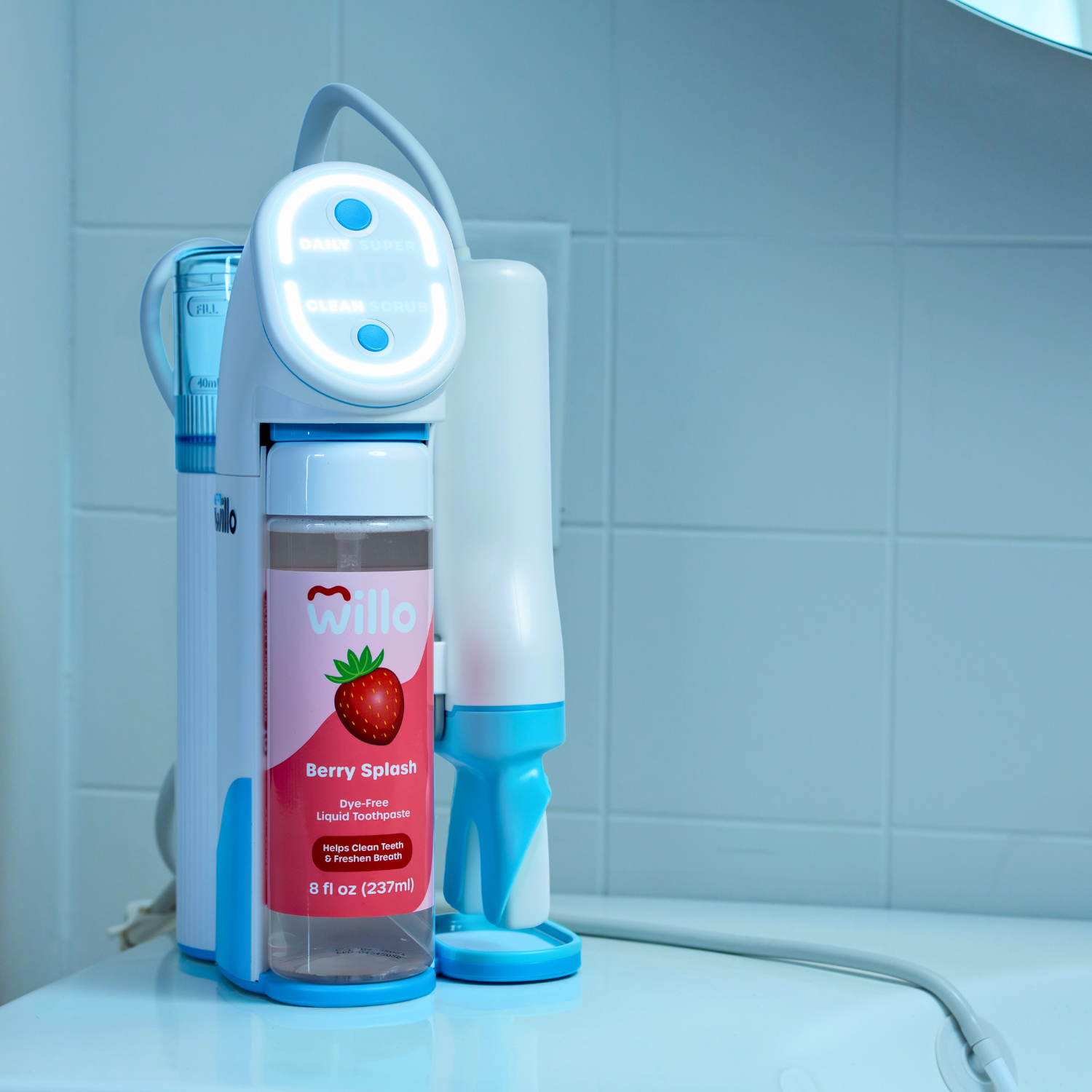 Willo dental product with a strawberry-flavored bottle on a bathroom counter.