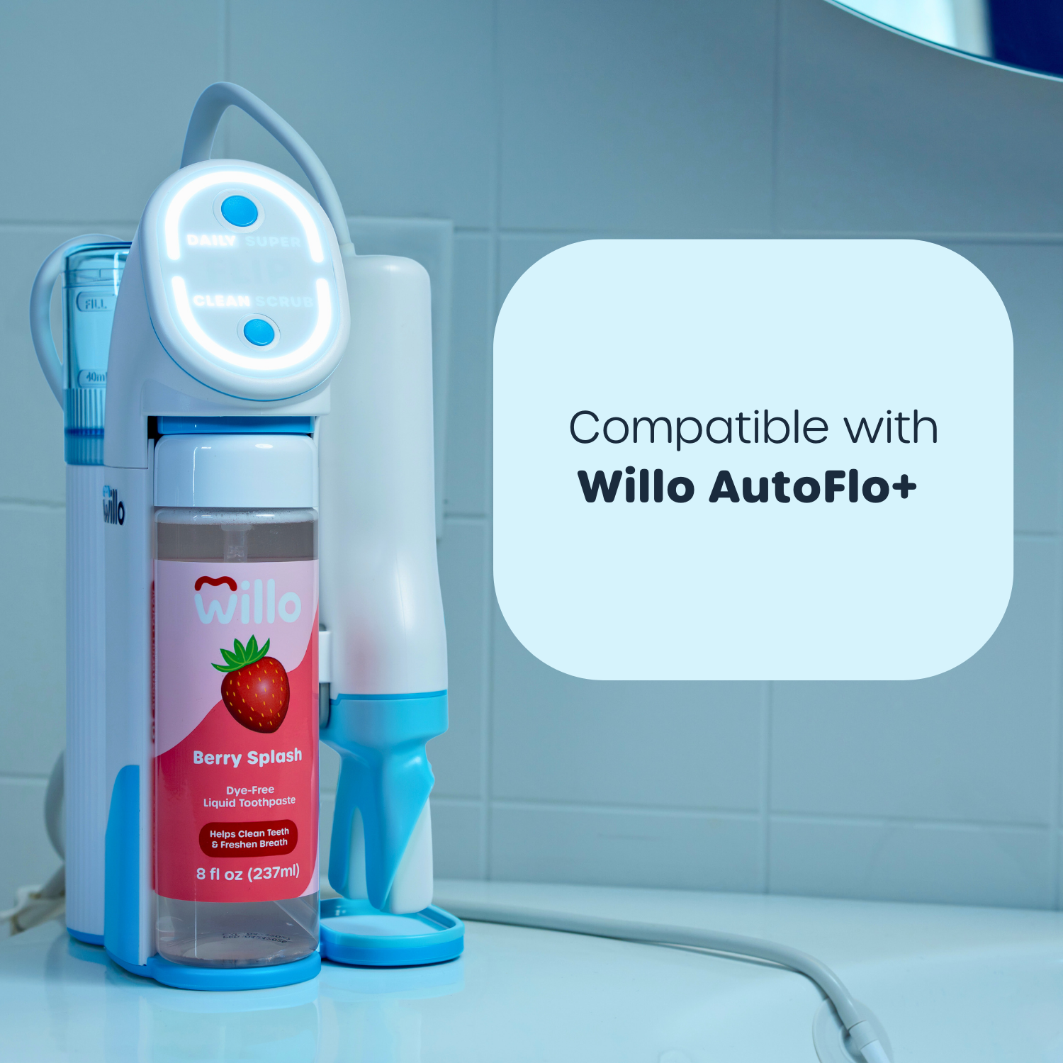 Willo dental product with a bottle labeled 'Berry Splash' and compatibility text for Willo AutoFlo+ on a bathroom counter.