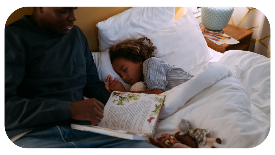 Dad putting daughter to bed after an easy bedtime routine