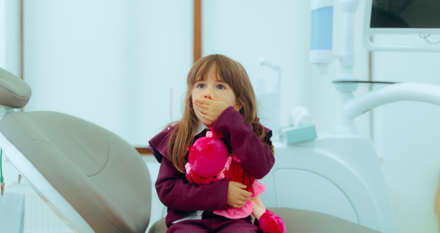 Girl with anxiety at the dentist office