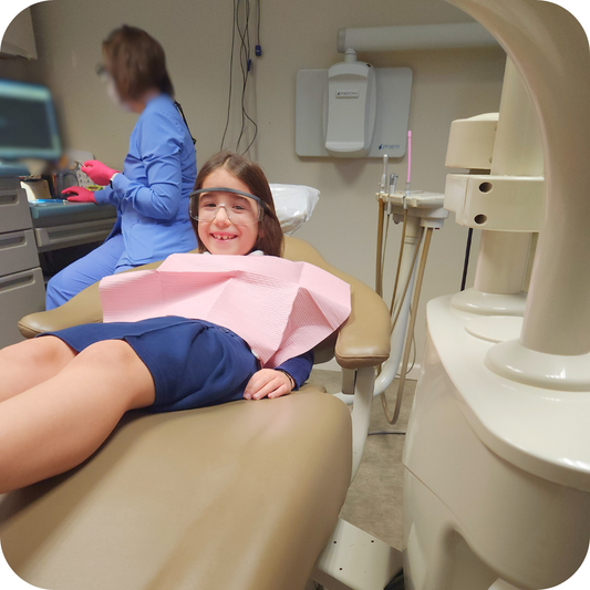 Smiling girl at dentist office