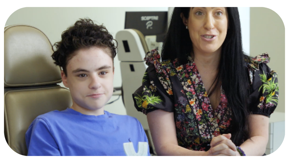 Mom of autistic son and her son sit next to each other and discuss Willo toothbrush