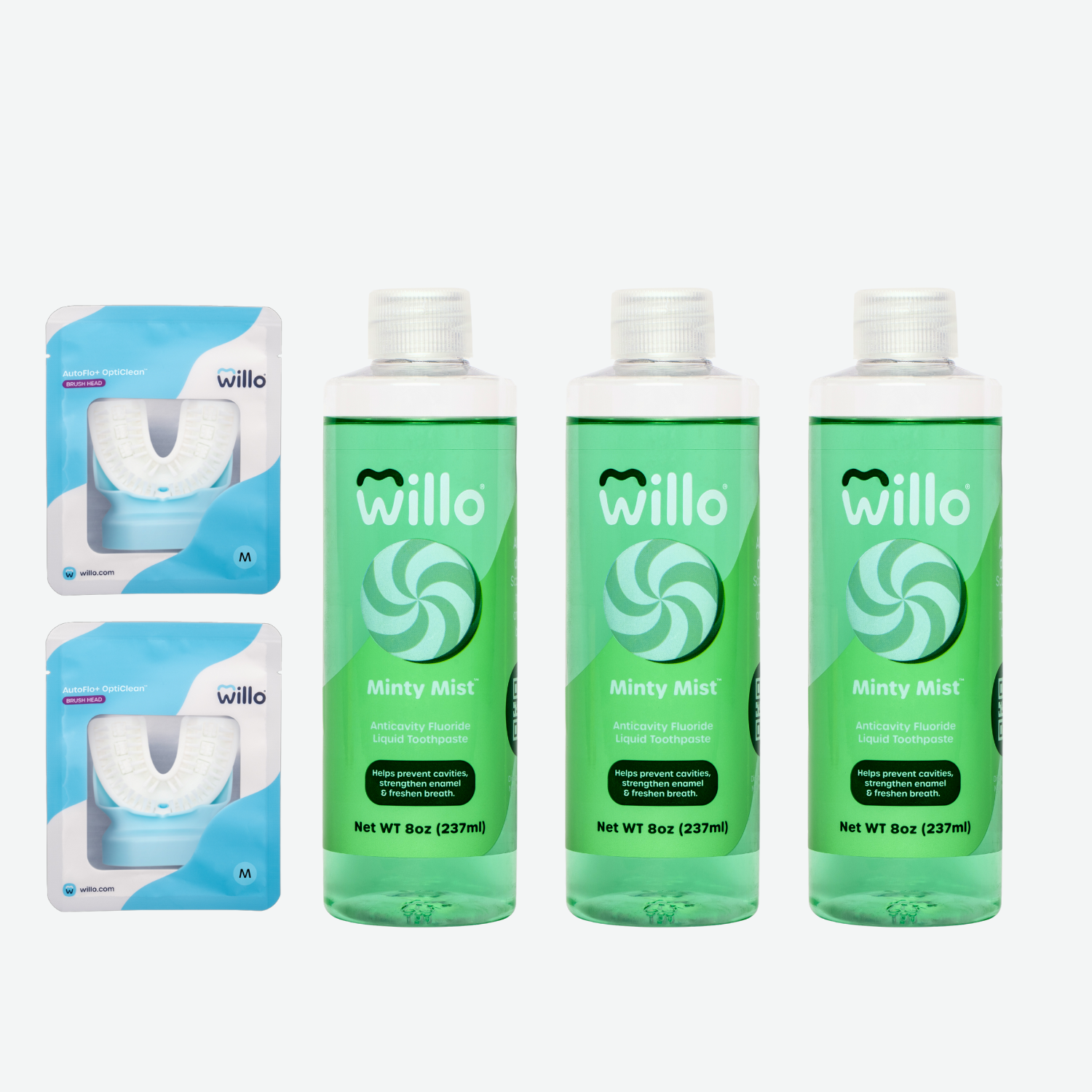 Three bottles of green liquid toothpaste in mint flavor and two brush heads