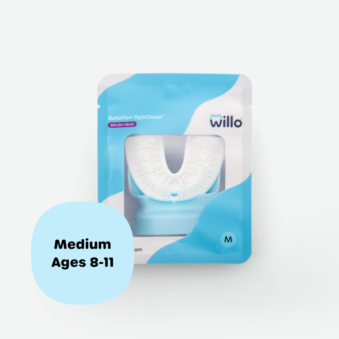 Willo AutoFlo+ OptiClean medium replacement brush head pack for kids and preteens ages 8 to 11. Sealed blue and white product packaging with a clear window displaying the silicone mouthpiece brush head.