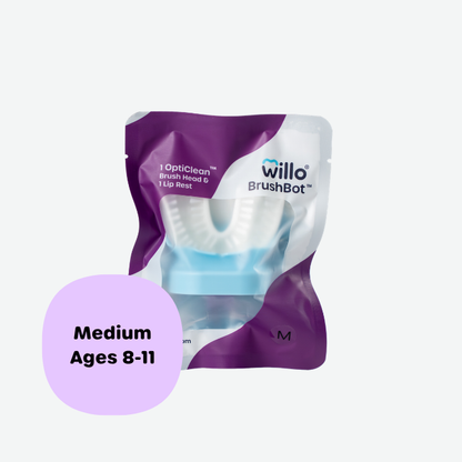 Willo BrushBot medium replacement pack containing one OptiClean brush head and one lip rest for kids ages 8 to 11. Sealed purple and white product packaging featuring the Willo brand logo.
