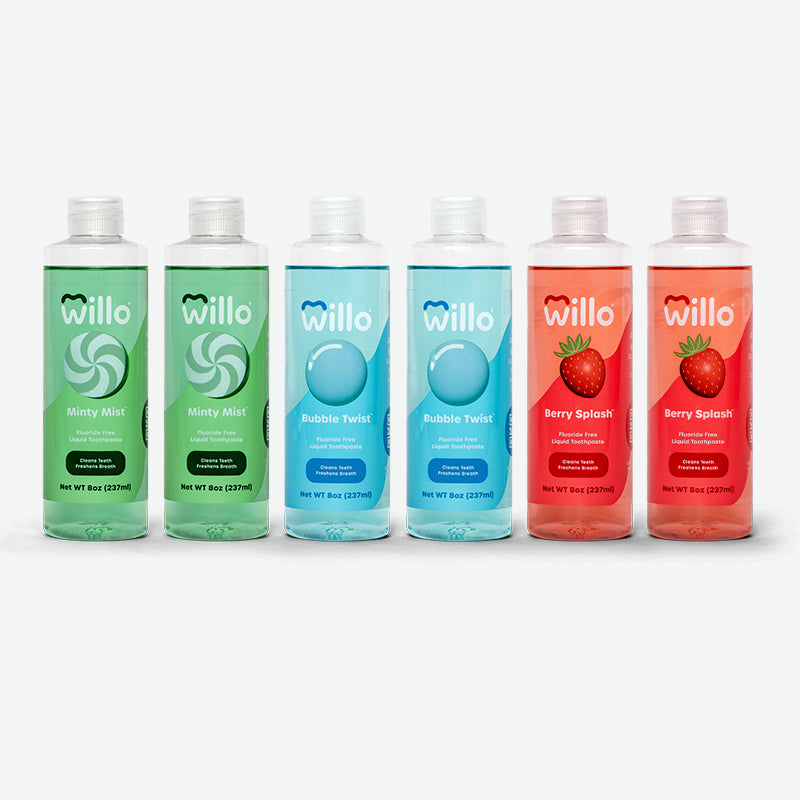 Six bottles of liquid toothpaste, 2 green mint flavors, 2 blue bubblegum flavored and 2 red berry flavored.