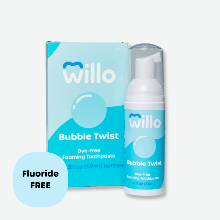 Willo Bubble Twist dye-free foaming toothpaste pump bottle and matching product box. Features a light blue brand design and a circular callout badge highlighting the fluoride-free formula in a 2 fl oz (59ml) size.