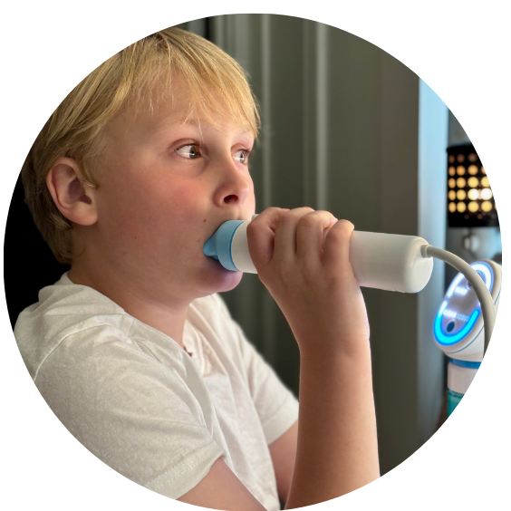 Boy brushing teeth with Willo auto brushing toothbrush