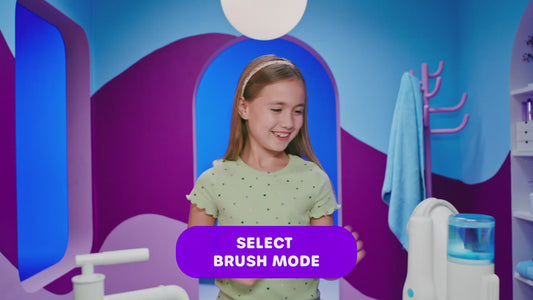 8 year old girl showing how to use AutoFlo+ to brush teeth